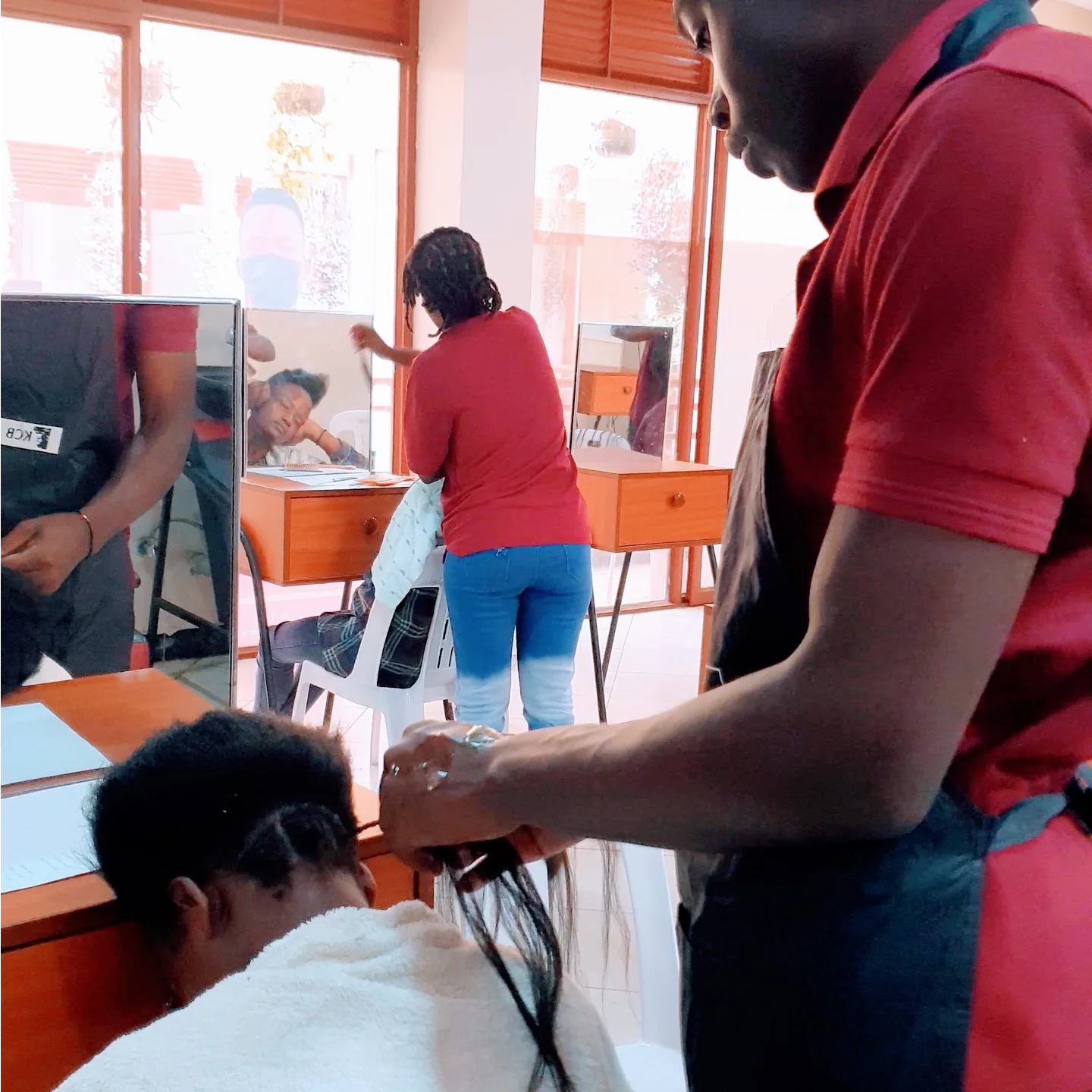 Student work at Zziwa Hair Academy