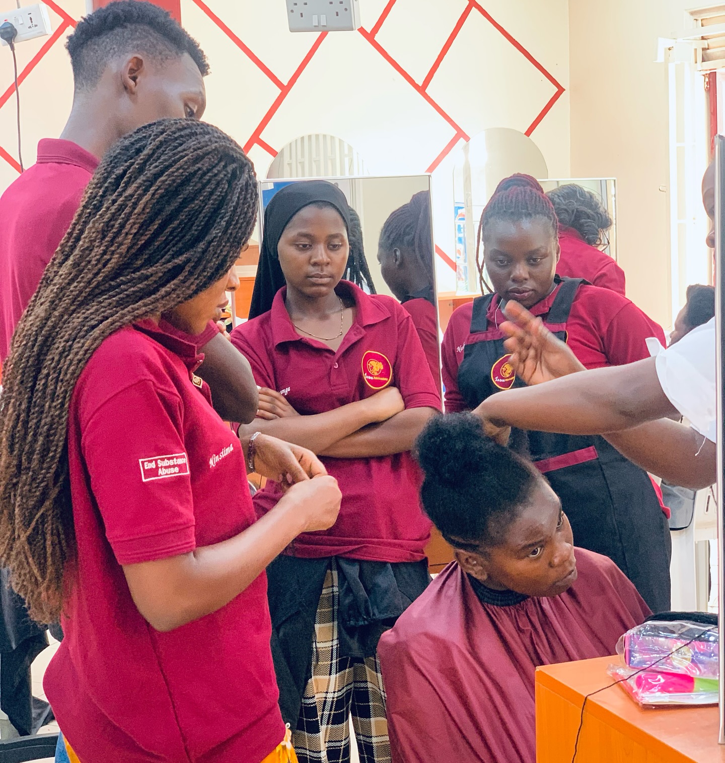 Student work at Zziwa Hair Academy
